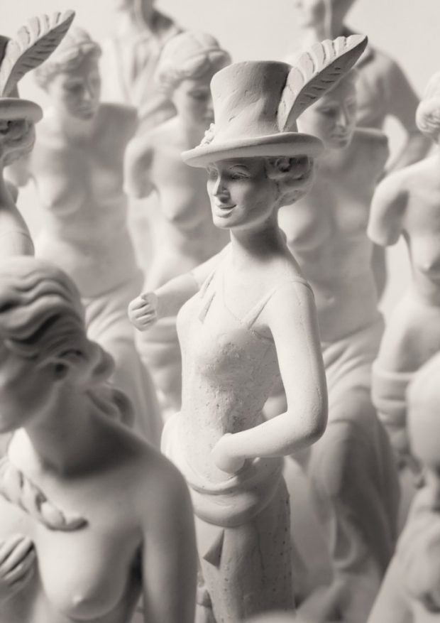 Repetitive, gypsum statuettes with characters from calendar
