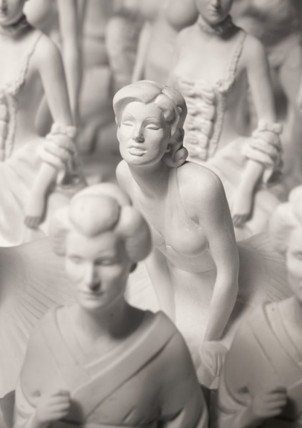 Repetitive, gypsum statuettes with characters from calendar
